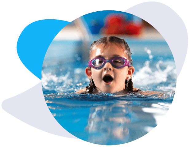 A child swimming in a lesson on her course in a swimming pool